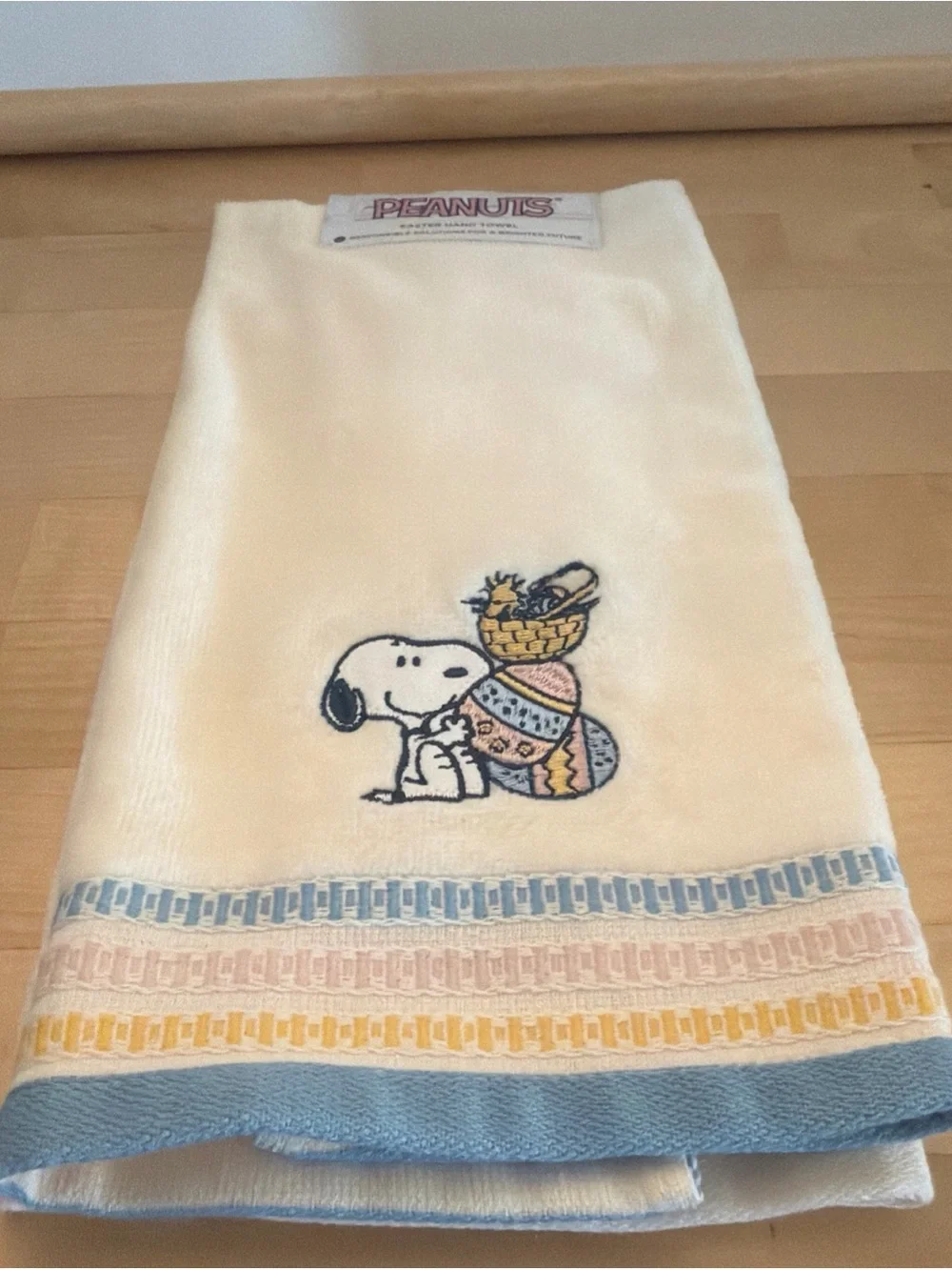 Peanuts Easter Cream Hand Towel with Pink Logo Accent